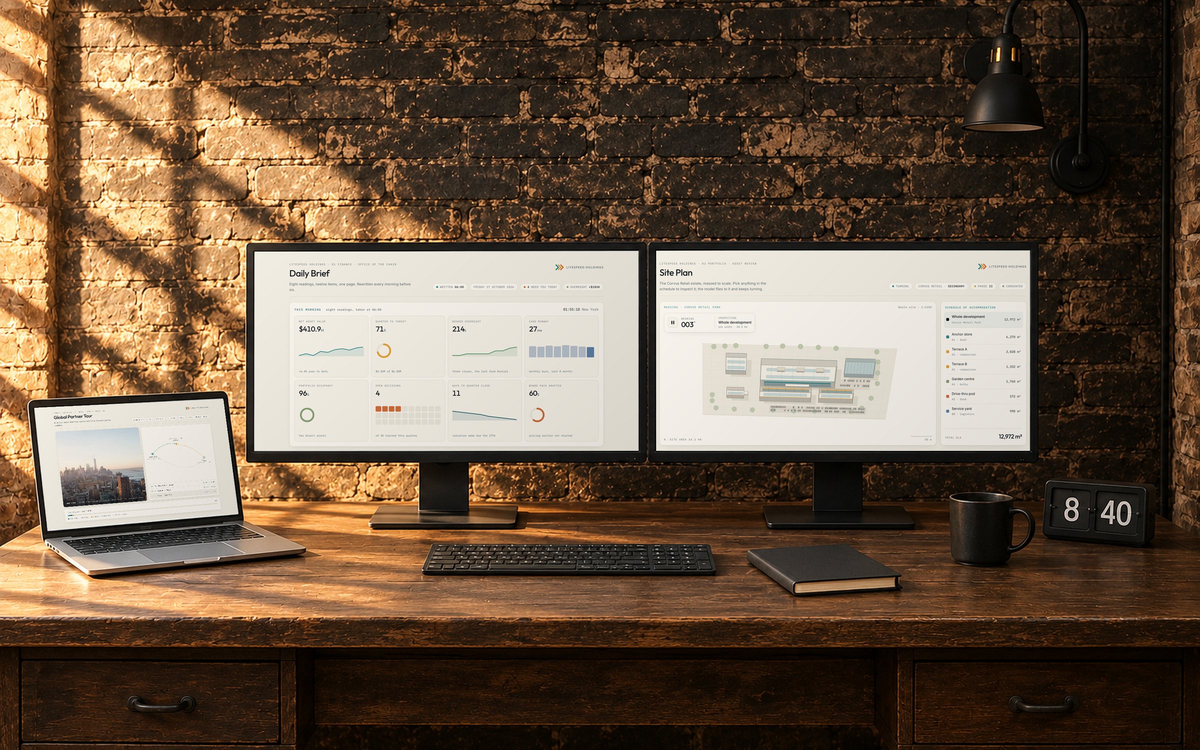 Explode on a desk in a brick room in morning light: a Daily Brief and a site plan on two monitors and a travel itinerary on the laptop, each page in its own window on its own screen.